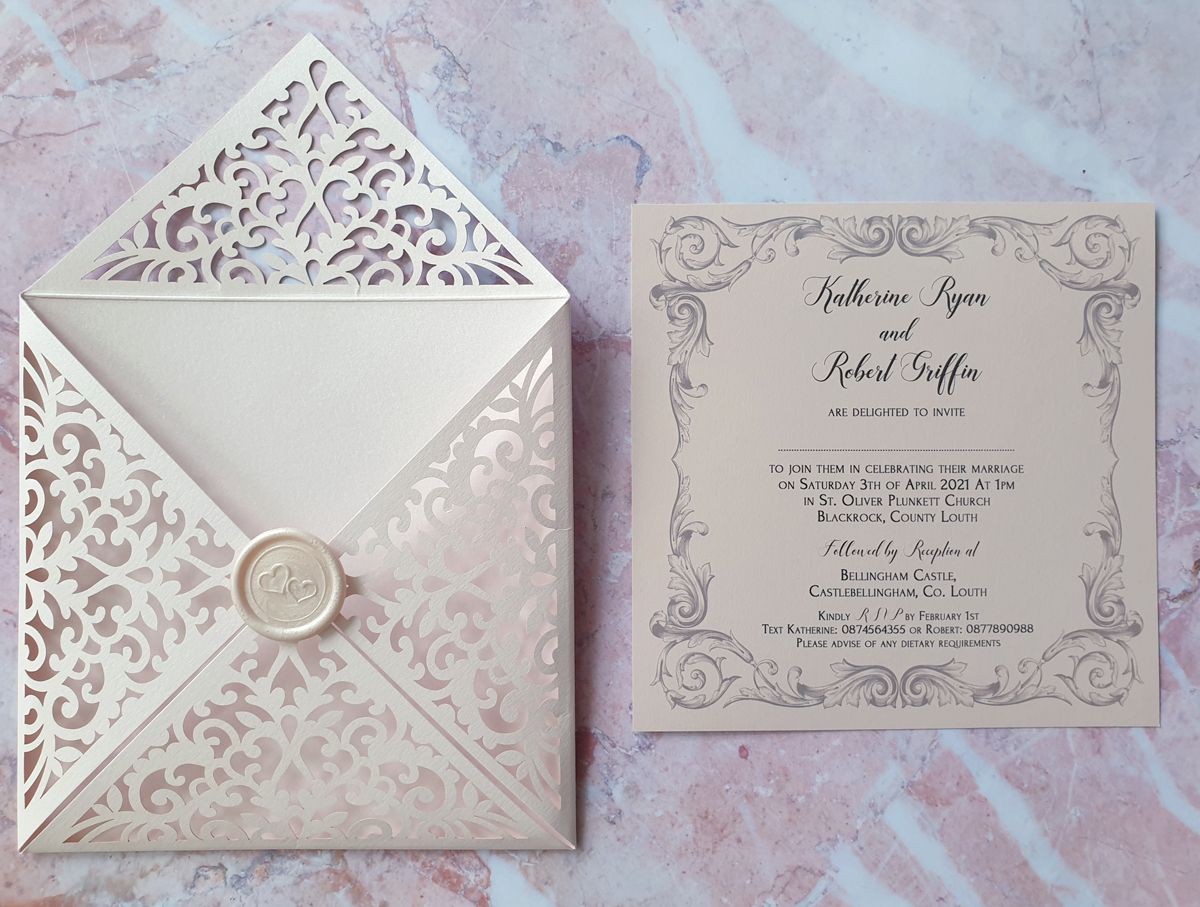 blush pink laser cut wedding invitation with wax seal
