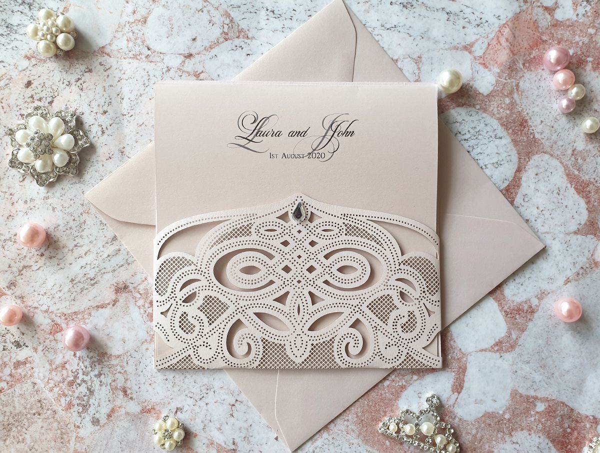 blush pink wedding invitation with delicate crystal