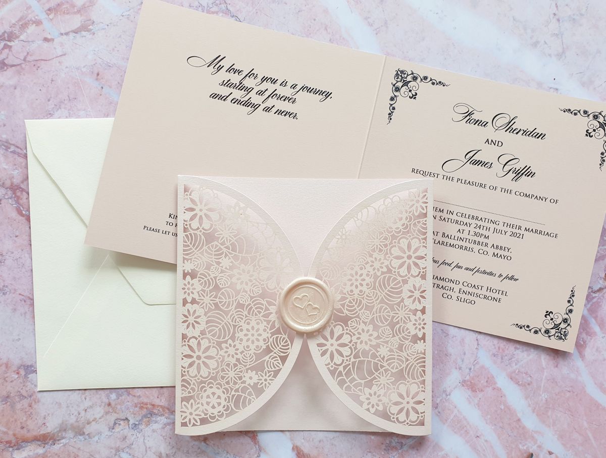blush pink laser cut wedding invitation with wax seal